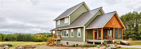 ranch house with metal roof|farmhouse with green metal roof.